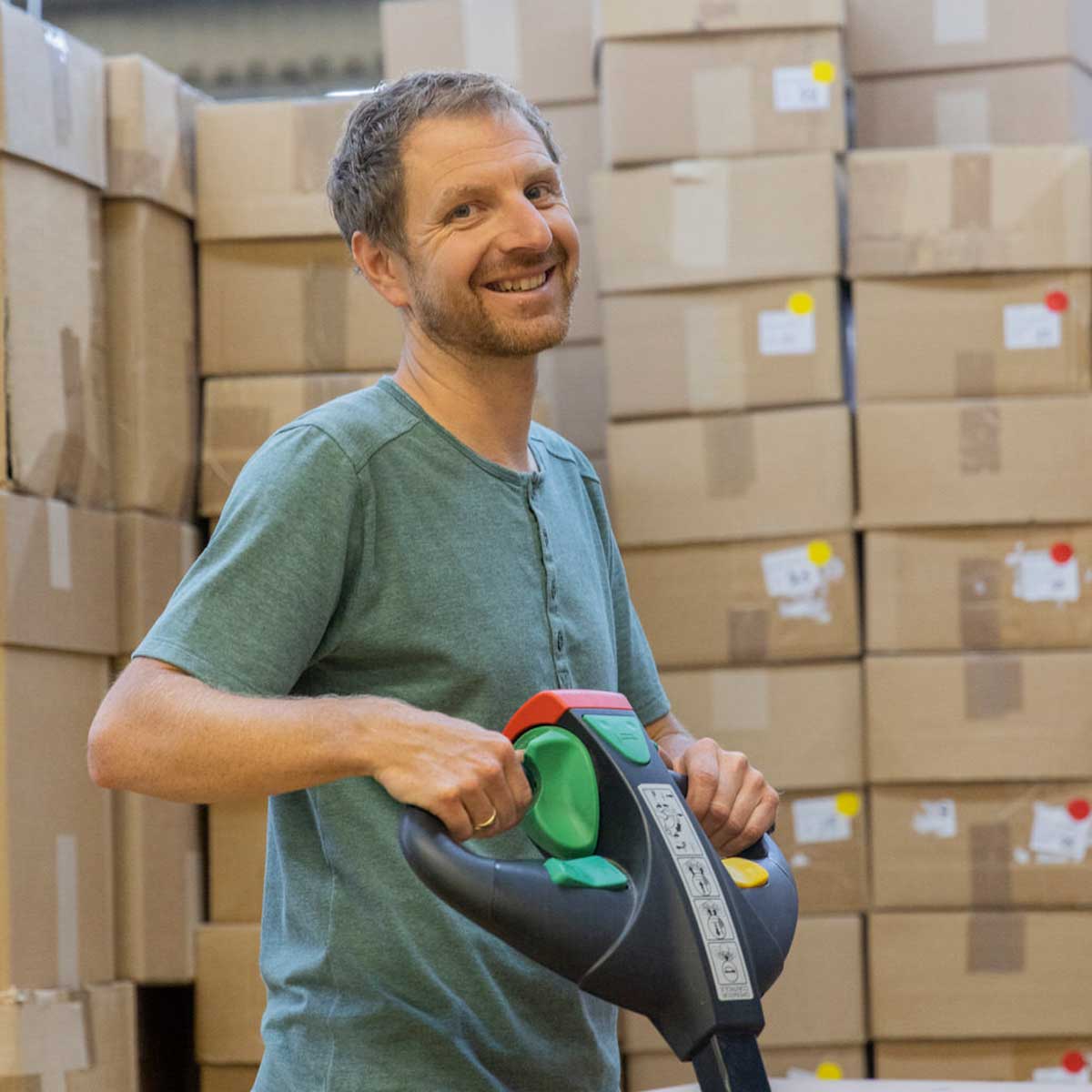 Employee in the warehouse with a pallet truck